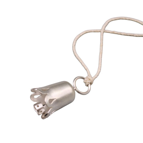Silver bell pendant on a white background