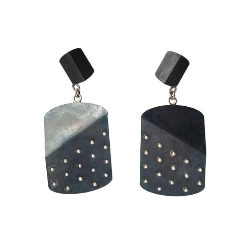 Pair of earrings with black and gray design on a white background